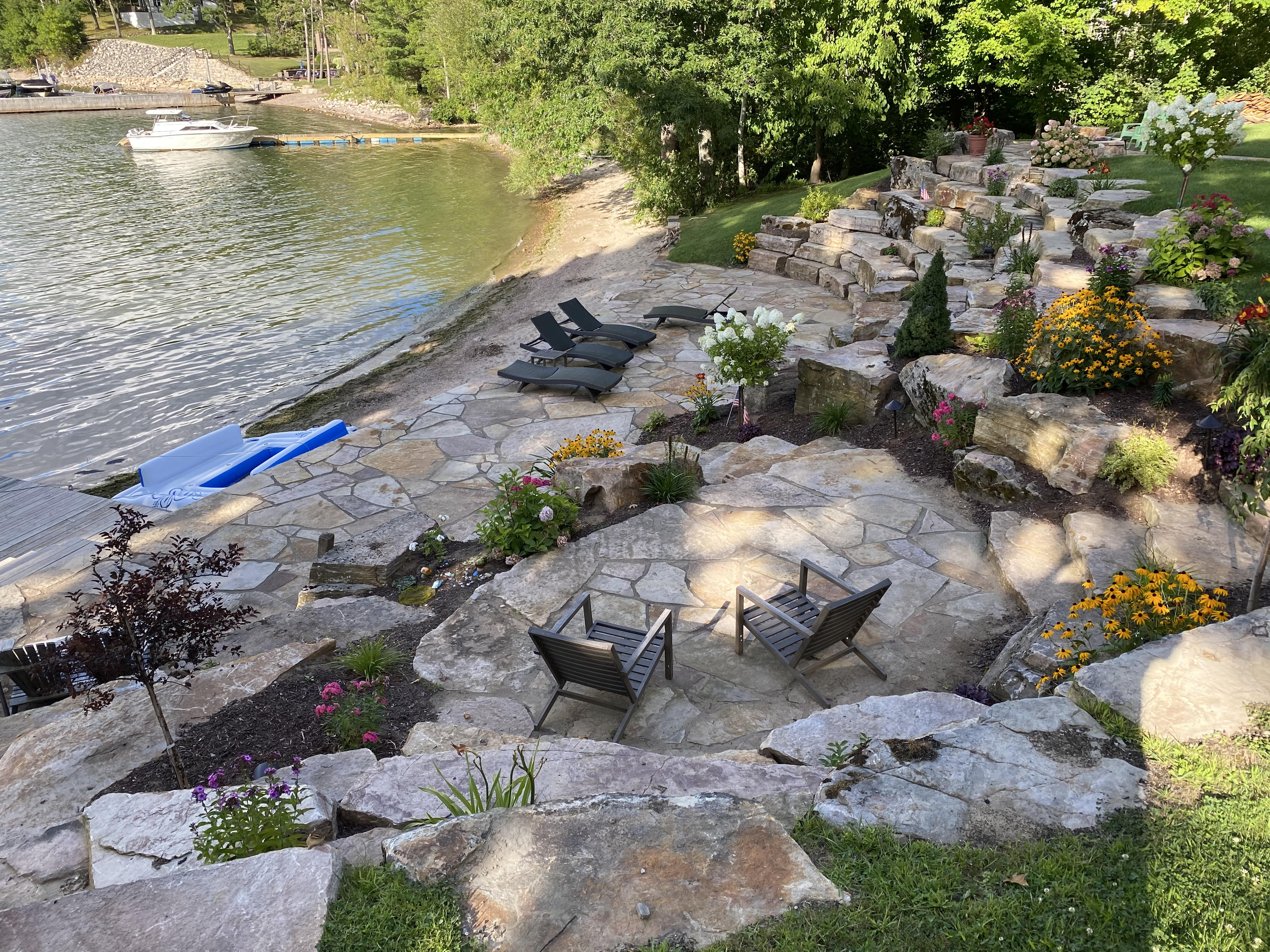Flagstone Patio Terraces with Boulders and Gardens